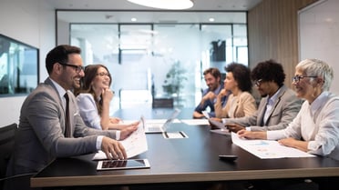 A group of people sitting at a table doing a workshop