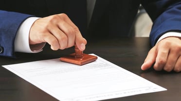 Certificate being stamped